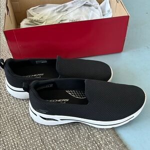 Skechers womans Black Slip-On Shoes. Size 8.5wide